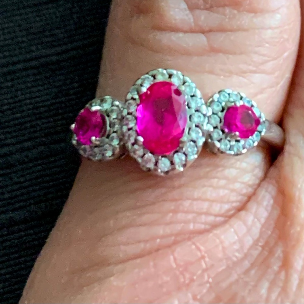 Sterling ring with lab created Ruby pink stones.